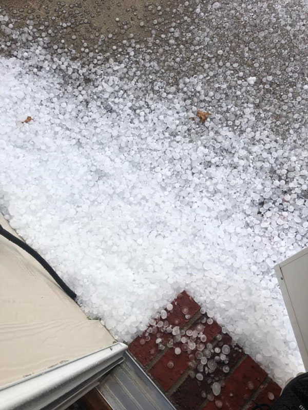 large pile of hail outside home after a storm