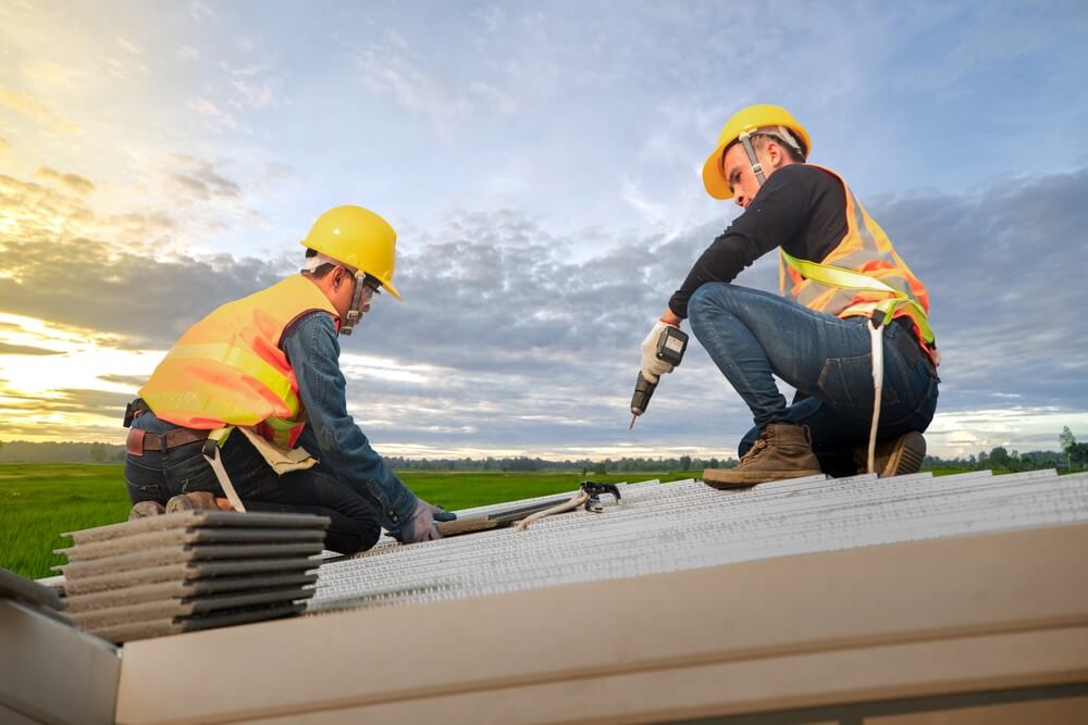 men repairing rooftop
