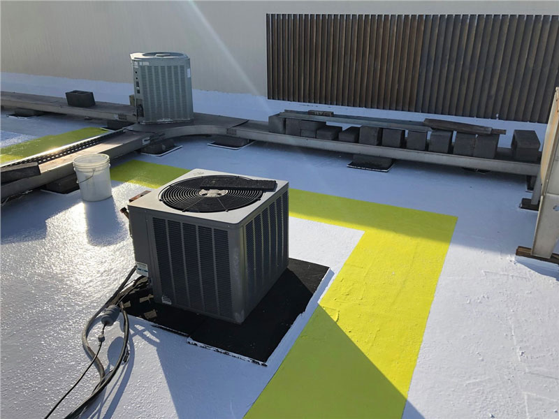 commercial rooftop with various HVAC equipment