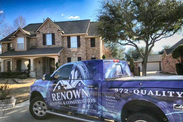 brick home with Renown Construction truck outside
