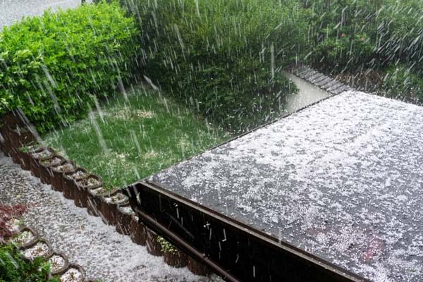 home rooftop during hail storm